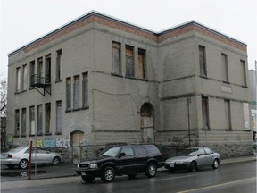 Taking down part of Claude Lauzon's property at 287 Cumberland St., the former Our Lady School, requires first knocking down his neighbouring semi-detached residential property at 207-209 Murray St., according to the city.