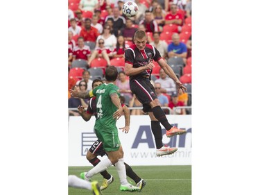Ottawa Fury FC defenceman Omar Jarun (right) heads the ball during their NASL soccer match-up at TD Place in Ottawa, July 20, 2014.