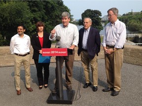 Ottawa Liberal MPPs Yasir Naqvi, Marie-France Lalonde, John Fraser and Bob Chiarelli join Mayor Jim Watson on Friday at an announcement to confirm the province will give the city $65 million for the Ottawa River Action Plan.