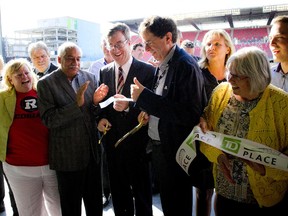 Ottawa Mayor Jim watson and Roger Greenberg, Chairman of the Ottawa Sports and Entertainment Group, cut the ribbon at the official opening of TD Place on July 9.