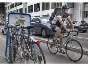 Bike Commuters head home using the Laurier Avenue bike lane.