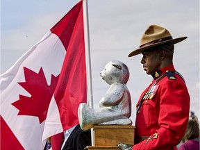 A Mountie brings the Panda trophy to last fall's revival of the annual Panda Game between the Carleton Ravens and the University of Ottawa GeeGees.