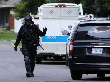 The Ottawa police tactical squad executed a search warrant at a home located at 19 Topley Crescent in the Hunt Club area on Friday, July 18, 2014.