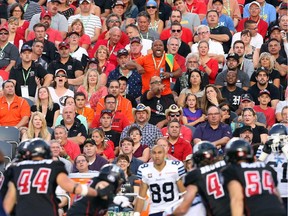 Ottawa Redblacks fans in action against the Toronto Argonauts at TD Place in Ottawa during the franchise home opener of the Redblacks, July 18, 2014.