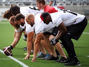 Ottawa Redblacks' Offensive line during Wednesday's practice on July 2, 2014 at TD Place Stadium. (Cole Burston/Ottawa Citizen)