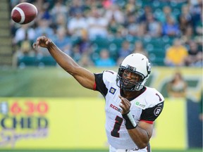 Henry Burris #1 of the Ottawa Redblacks makes a pass against the Edmonton Eskimos during a CFL game at Commonwealth Stadium on July 11, 2014 in Edmonton.