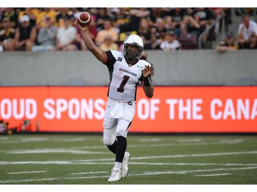 Henry Burris #1 of the Ottawa Redblacks completes a pass during CFL game action against the Hamilton Tiger-Cats on July 26, 2014 at Ron Joyce Stadium in Hamilton, Ontario, Canada.