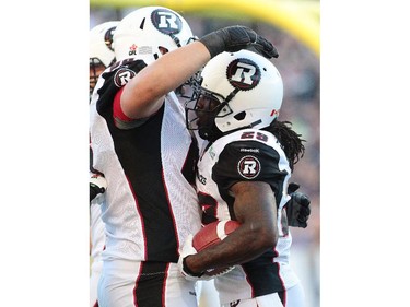Chevon Walker #29 of the Ottawa RedBlacks is congratulated for his touchdown in first half action in a CFL game against the Winnipeg Blue Bombers at Investors Group Field on July 3, 2014 in Winnipeg, Manitoba, Canada.