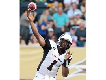 Henry Burris #1 of the Ottawa RedBlacks releases the ball in first half action in a CFL game against the Winnipeg Blue Bombers at Investors Group Field on July 3, 2014 in Winnipeg, Manitoba, Canada.