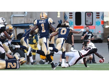 Dobson Collins #80 of the Ottawa RedBlacks gets a touchdown in first half action in a CFL game against the Winnipeg Blue Bombers at Investors Group Field on July 3, 2014 in Winnipeg, Manitoba, Canada.