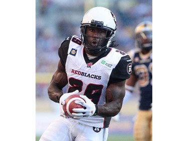 Chevon Walker #29 of the Ottawa RedBlacks runs in for a touchdown in first half action in a CFL game against the Winnipeg Blue Bombers at Investors Group Field on July 3, 2014 in Winnipeg, Manitoba, Canada.