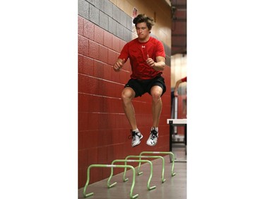 Ottawa Senators' NHL prospect Max McCormick jumps a hurdle during their annual development camp at Canadian Tire Centre in Ottawa on July 03, 2014.