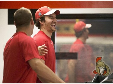 Ottawa Senators' prospect, Darren Kramer, left, has a laugh with Mark Stone, right,  during the 2014 Development Camp at the Canadian Tire Centre Tuesday, July 1, 2014.