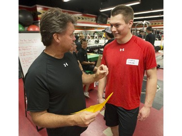 Ottawa Senators' skating coach, Marc Power talks with Curtis Lazar, right, during in the 2014 Development Camp at the Canadian Tire Centre Tuesday, July 1, 2014.