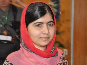 Pakistani activist Malala Yousafzai, who survived being shot by the Taliban because she advocated education for girls, visits Abuja, Nigeria, Sunday July 13, 2014. Malala Yousafzai traveled to Abuja in Nigeria to meet the relatives of schoolgirls who were kidnapped by Boko Haram three months ago.