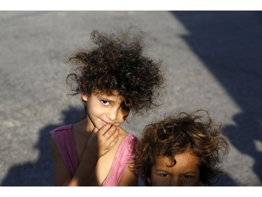 Displaced Palestinian children pose for a picture in Gaza City on July 26, 2014. Israel's security cabinet has approved a four-hour extension of a temporary truce in Gaza, prolonging an initial 12-hour ceasefire until midnight, Israeli television reported.