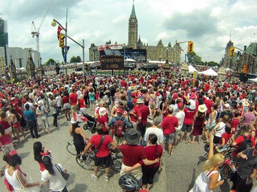 People flock to Parliament Hill and the downtown core to enjoy Canada's 147th birthday. Photo taken at 12:44 on July 1, 2014.