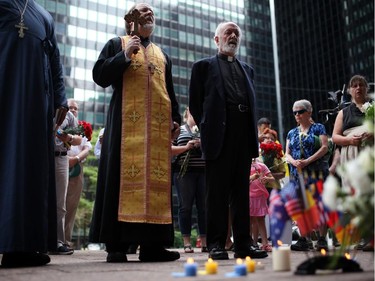 People gather during a vigil outside the Netherlands Embassy, as tension grows in Ukraine and Russia over the downing of a Malaysian Passenger Jet this past week.