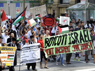 People march along Wellington Street in support of Palestinians in Gaza in Ottawa on Tuesday, July 22, 2014.