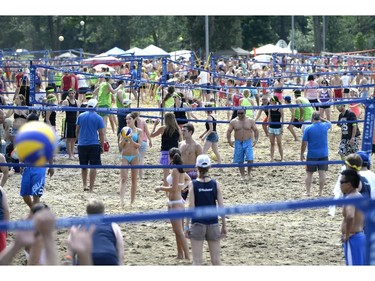 People play volleyball as they take part in the HOPE Volleyball Summerfest at Mooney's Bay Beach in Ottawa on Saturday, July 12, 2014.