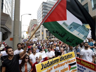 People rally outside the Israeli Embassy in Ottawa in support of Palestinians in Gaza on Tuesday, July 22, 2014.