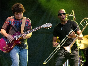 Pete Murano (L) and Trombone Shorty perform on the River Stage at Bluesfest.