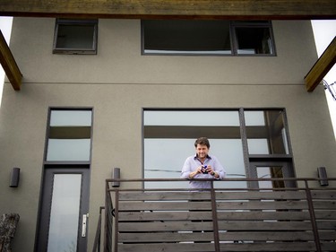 Peter Kincaid enjoys the view from the front deck, where oversized beams of Douglas fir glulam add an industrial look.