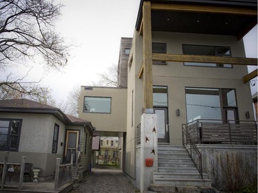 The office bridges the old and new home with a driveway underneath. A planning quirk meant the new home had to be attached to the old with a usable space.