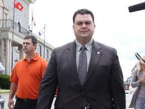 PETERBOROUGH, JULY 9, 2014 ��� DEL MATRO TRIAL ��� MP Dean Del Mastro navigates the media scrum during lunch break for his trial in Peterborough on July 9, 2014. Del Mastro and official agent Richard McCarthy are accused of campaign overspending and falsifiying documents to cover up the overspending.   (Glenn Lowson photo for Postmedia News) For Stephen Maher, Postmedia News ORG XMIT: POS1407091313181497