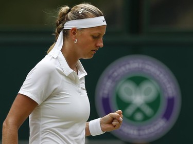 Petra Kvitova of the Czech Republic celebrates winning a point against Eugenie Bouchard of Canada during the women's singles final at the All England Lawn Tennis Championships in Wimbledon, London, Saturday July 5, 2014.
