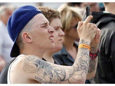 Phil Lallier works hard to get a picture of rapper Danny Brown at Bluesfest opening night Thursday, July 3, 2014.