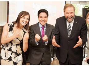 This Facebook photo shows Marie-Christine Lalonde-Fiset and Hoang Mai, with NDP leader Tom Mulcair.