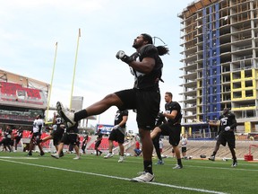 The Ottawa Redblacks work out as construction surrounds their field at TD Place.