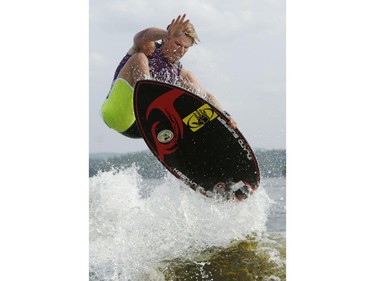 Pro wake surfer, Keenan Flegel, from Florida catches some air as he competes in the Canadian Wake Surf Nationals in Calabogie Lake Friday July 25, 2014. The premier wake surfing event runs until Sunday.