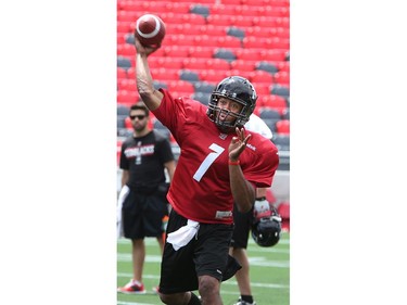 QB Henry Burris throws as the Ottawa Redblacks practice at TD Place Stadium at Lansdowne Park on Monday, July 14, 2014.