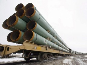 Rail cars arrive in Milton, N.D., loaded with pipe for TransCanada's Keystone Pipeline project in this Feb. 28, 2008 file photo. The fate of the contentious Keystone XL pipeline could have an impact on investors' portfolios in more ways than one.