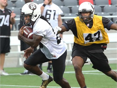 RB Chevon Walker carries the ball up the field as the Ottawa Redblacks have their first practice at home since losing their opening season game against Winnipeg.