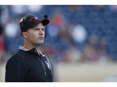 Ottawa Redblacks head coach Rick Campbell looks up at the scoreboard during the first half of CFL action against the Winnipeg Blue Bombers in Winnipeg Thursday, July 3, 2014.