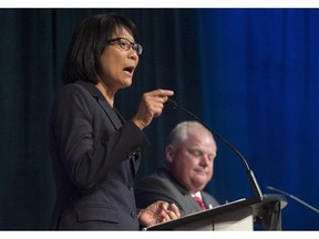 Olivia Chow, left, debates with fellow mayoral candidate Rob Ford during a Toronto mayoral debate in Toronto on Tuesday, July 15, 2014.