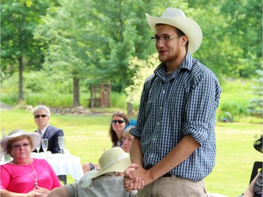 Ryan Hreljac addresses the crowd at a high tea charity event held Sunday, July 20, 2014, in Plaisance, Que. in support of a charity he founded, Ryan's Well Foundation.