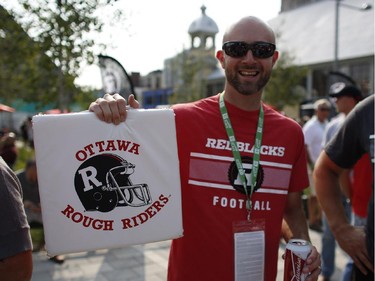 Ryan McCloskey brought an Ottawa Rough Riders seat cushion from the 80s to the Redblacks' home opener at TD Place on Friday, July 18, 2014.
