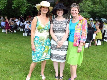 Ryan's Well Foundation board member Kelly Arnott with Wendy Smythe of DS Plumbing and executive director Jane Baird at a high tea charity event held Sunday, July 20, 2014, at a private home in Plaisance, Que.