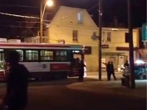 A still from a video posted to YouTube shows Toronto police in an altercation with 18-year-old Sammy Yatim on a streetcar in Toronto.