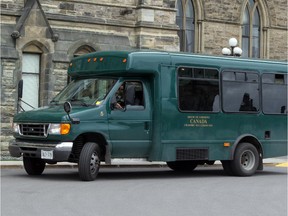 OTT0920(2006)--(OTTAWA)--SHUTTLE--Parliament Hill--green shuttle bus drivers will not be allowed to wear red on Friday to support the troops--for CITY standalone.  Photo by PAT MCGRATH --THE OTTAWA CITIZEN. ASSIGNMENT NUMBER 79166