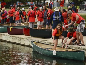 Six police departments and five Aboriginal youth groups got together to spend the day in the 14th Annual Flotilla on Wednesday, July 9, 2014. Friendship. (James Park / Ottawa Citizen)