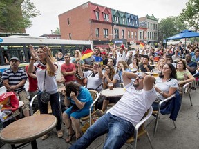 Soccer fans watch the World Cup soccer final between Germany and Argentina in Montreal, Sunday, July 13, 2014.