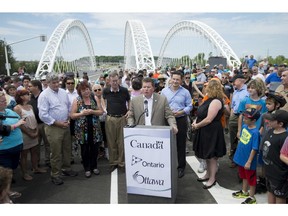 Steve Desroches, councillor for Gloucester - South Nepean, speaks during the grand opening of the Strandherd-Armstrong Bridge in Ottawa on Saturday, July 12, 2014. The bridge connects the communities of Barrhaven and Riverside South over the Rideau River.