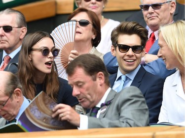 English actress Keira Knightley (L) and husband English musician James Righton sit in the Royal Box on Centre Court before the start of the women's singles final match between Canada's Eugenie Bouchard and Czech Republic's Petra Kvitova on day twelve of the 2014 Wimbledon Championships at The All England Tennis Club in Wimbledon, southwest London, on July 5, 2014.