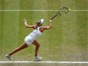 Canada's Eugenie Bouchard returns to Czech Republic's Petra Kvitova during their women's singles final match on day twelve of the 2014 Wimbledon Championships at The All England Tennis Club in Wimbledon, southwest London, on July 5, 2014.