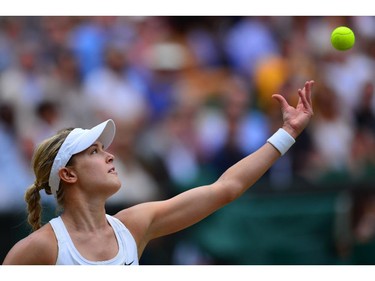Canada's Eugenie Bouchard serves to Czech Republic's Petra Kvitova during their women's singles final match on day twelve of  the 2014 Wimbledon Championships at The All England Tennis Club in Wimbledon, southwest London, on July 5, 2014.